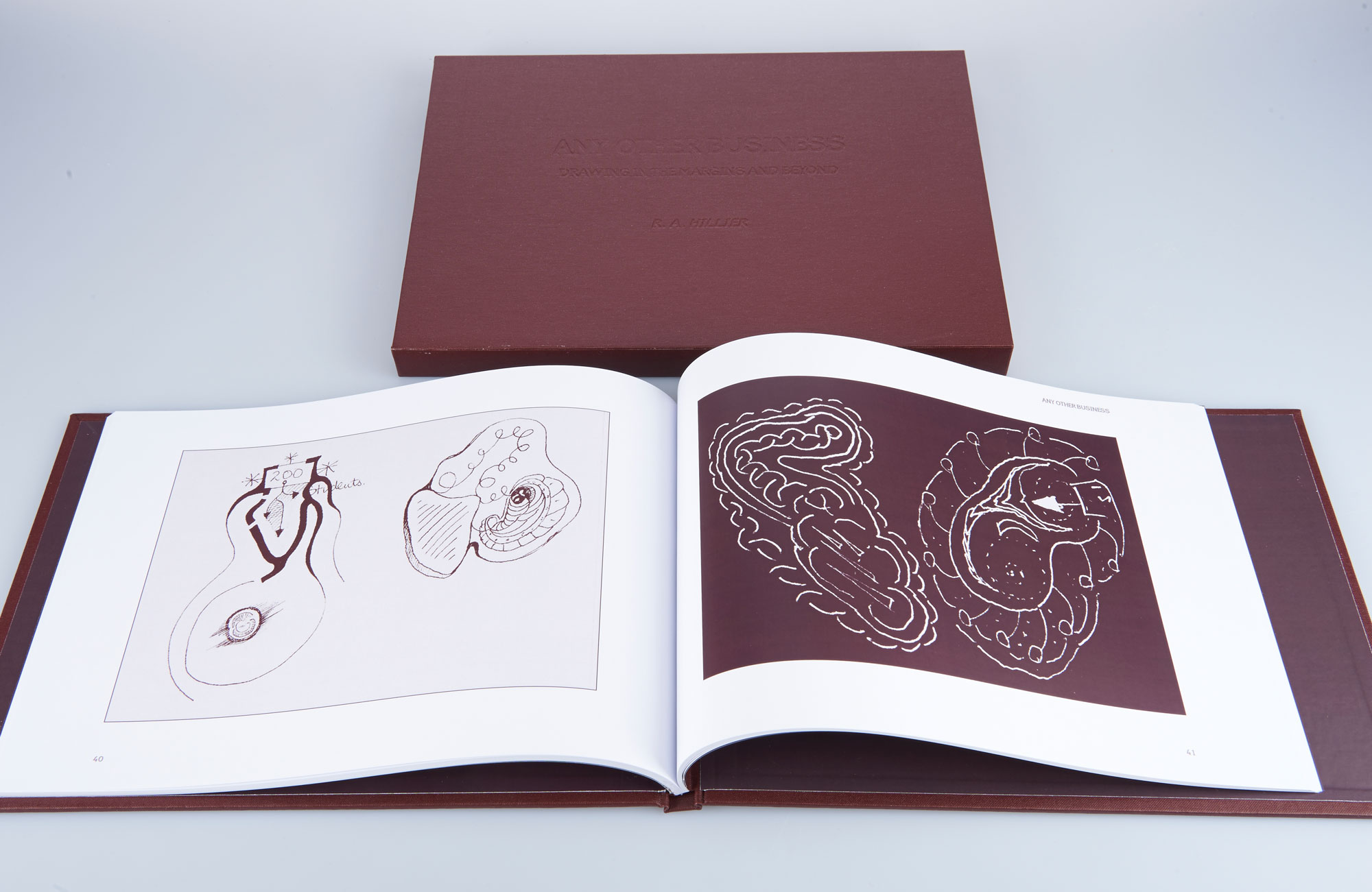 Photograph of the case bound front cover with dark brown cloth, then in front, the book open showing scientific cell illustrations on each page